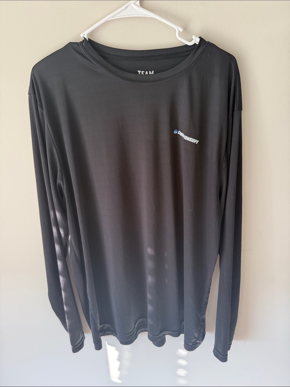 NCAA Championship Black Long-Sleeve Performance Tee with Small Chest Logo XXL